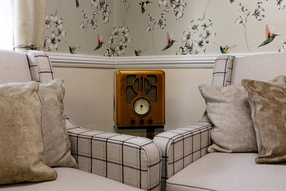 Photo of an old radio in the sitting room of Astley Grange Care Centre