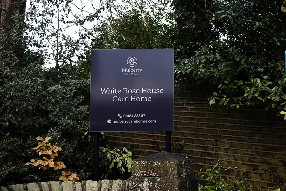 Photo of a sign outside White Rose House Care Home